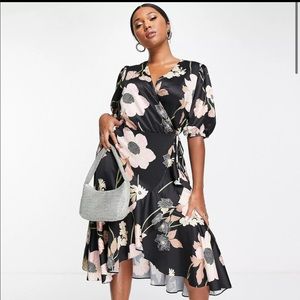 ASOS DESIGN Curve satin midi wrap dress with puff sleeves in floral print.